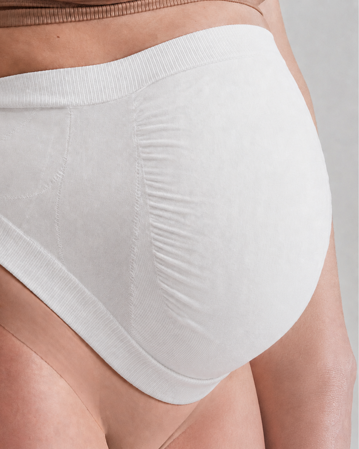 Secret Saviours The Band in white — close-up side view showing Derma Dot™ fabric texture