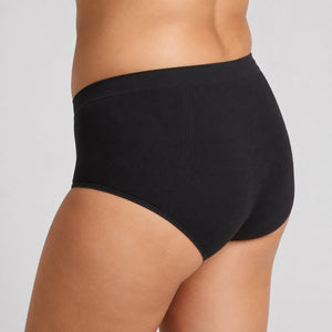 Side view of black C-section recovery briefs showing the high waist and seamless fit