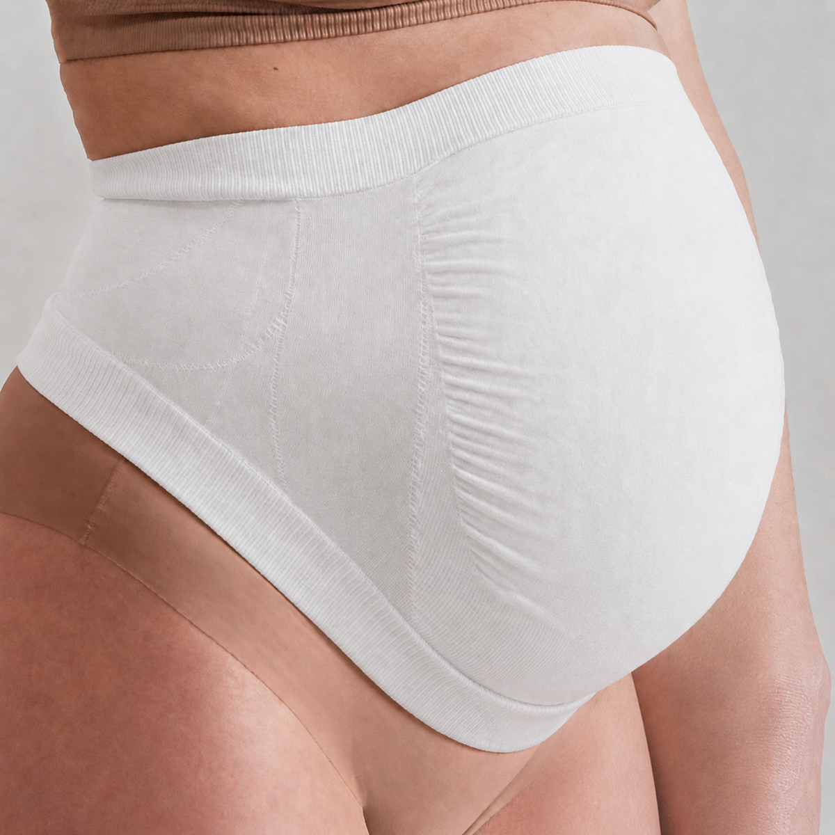 Secret Saviours The Band in white — close-up side view showing Derma Dot™ fabric texture
